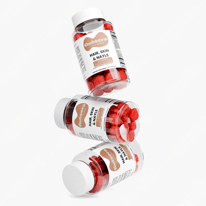 Three bottles of 'Hair, Skin & Nails' supplement with a white background