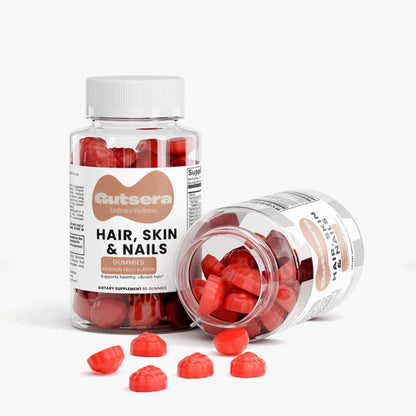 Hair, Skin & Nails gummy supplement bottles with red gummies on a white background